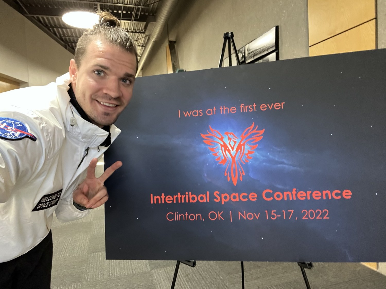 At the Intertribal Space Conference sign